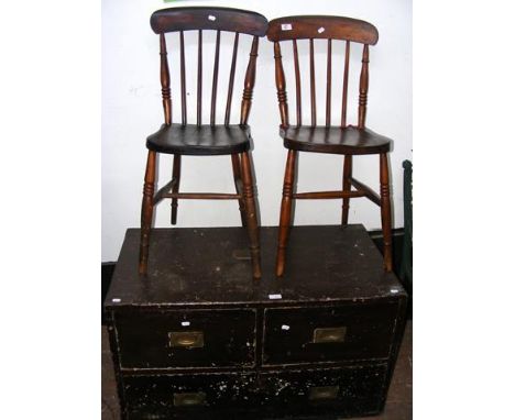 A pine tool chest of two short and one long drawer with brass flush handles and a pair of stick back chairs 