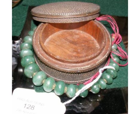 A 7.5cm diameter shark skin antique trinket box, together with a jade necklace 