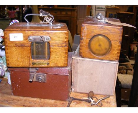 An old pigeon racing clock manufactured by Hudsons in carrying case, together with one other 