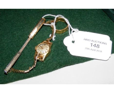 A lady's gold cased watch, together with a ring 