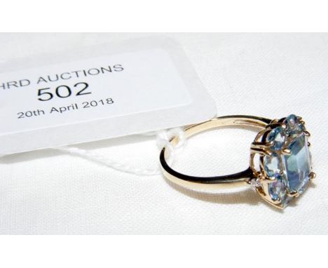 A 9ct yellow gold ring set with blue stone - Size P 