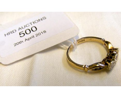 A 9ct yellow gold three stone diamond ring - Size K 