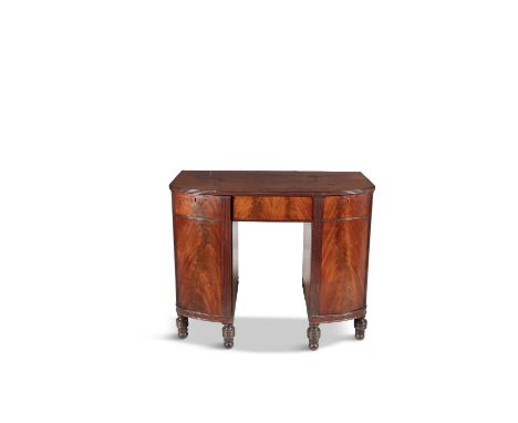 A GEORGE IV MAHOGANY BOWFRONT COMPACT DESK, with single frieze drawer flanked by reeded pilasters and single drawer above sin