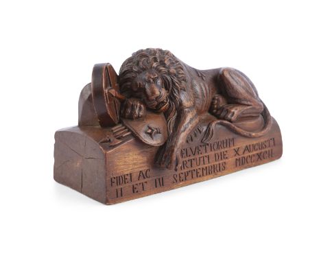 A CARVED WOODEN MODEL OF THE 'LION OF LUCERNE' AFTER THORVALDSON. 19cm wide x 10.5cm high x 8cm deepThe Lion of Lucerne is a 