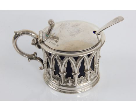 A Victorian silver mustard pot of Gothic design with marks for Sheffield 1840 and Henry Wilkinson &amp; Co with earlier spoon