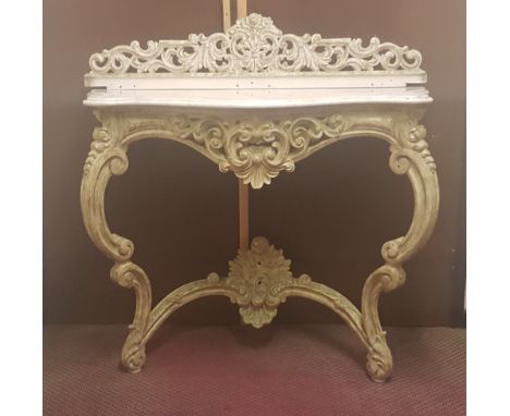 An early to mid 20th century French white marble console table with pierced raised back repainted cream. IMPORTANT: Online vi