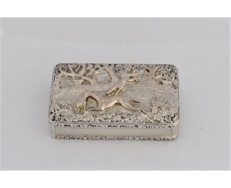 A William IV silver snuff box with decorative top depicting a hunting scene with fox and hounds and marks for Birmingham 1832