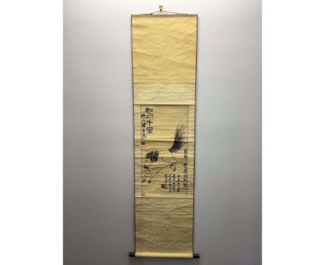 A traditional Chinese hanging scroll featuring a dynamic woven threading of a horse, applied on brocade fabric with a paper s