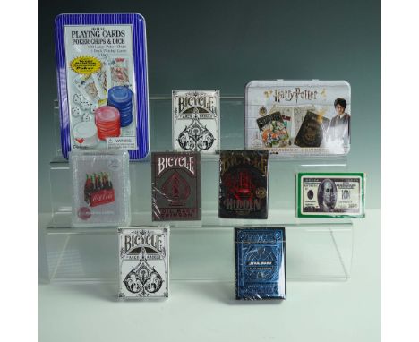 A varied collection of nine themed playing card and game sets. Includes a deluxe Cardinal tin set with 100 poker chips, 5 dic