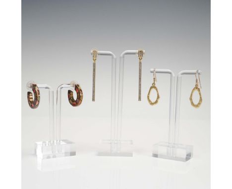 Modern 3-piece earring set featuring varied silhouettes and finishes. Includes a pair of sculptural gold-tone dangle earrings