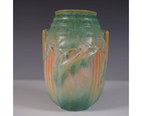 A stunning Roseville Pottery Laurel vase featuring an elegant Art Nouveau-inspired floral relief design. This handled vase is