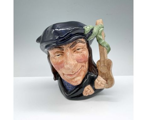 Hand decorated figural jug. In the 17th century comedy, written by Edward Ravensroft, Scaramouche appears as a boastful, fool