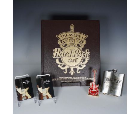 A collection of five Hardrock collectibles including a copy of Treasures of the Hard Rock Cafe: The Official Guide to the Har