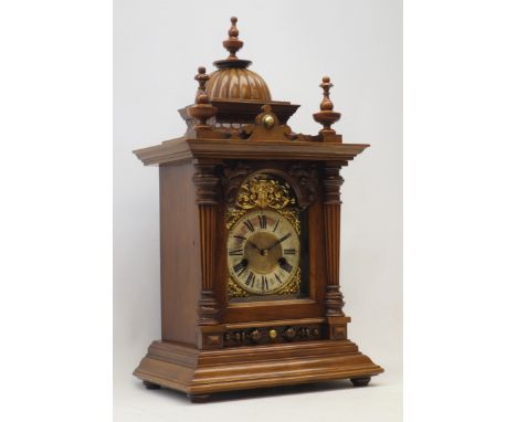 Early 20th century walnut mantel clock, architectural case, gadroon dome top with turned finials, single bevel glazed door wi