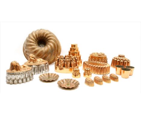 Fourteen various copper jelly moulds , a copper pricket candlestick and three copper beakers Provenance: The property of the 