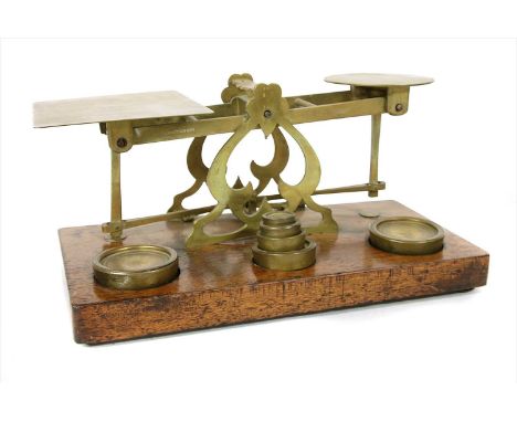 A large set of Sampson Mordan and Co brass postal scales and weights, 17cm high