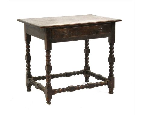 An oak side table, with a single drawer on bobbin turned supports, 85cm wide Provenance: The property of the late Mr &amp; Mr