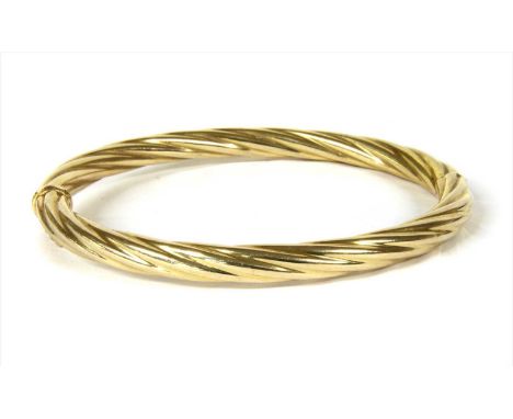 An Italian 9ct gold hinged twisted wire bangle, concealed box clasp, defective, with a figure of eight safety catch, import h
