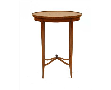 An Edwardian strung satinwood oval lamp table ,50cm wide x 69cm high Provenance: The property of the late Mr &amp; Mrs Brian 