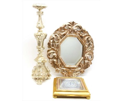 A silvered wooden pricket candlestick , 59cm long, a similar wall mirror, 49cm high and a pottery stand (3)  Provenance: The 