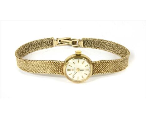 A ladies' 9ct gold Omega mechanical bracelet watch, round case 17mm in diameter, silvered dial with raised gilt and black bat