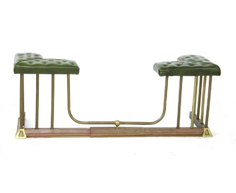 An early 20th century brass and copper club fender, with green seat pads, 136cm wide, 42cm deep, 52cm high