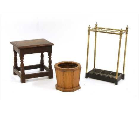 A brass and iron stick stand, a low oak stick stand and an oak joined stool (3) Provenance: The property of the late Mr &amp;