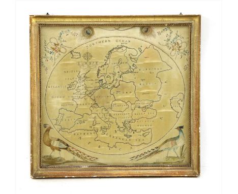 A map sampler of Europe , early 19th century in an oval panel, the spandrels embroidered with peacock features floral garland