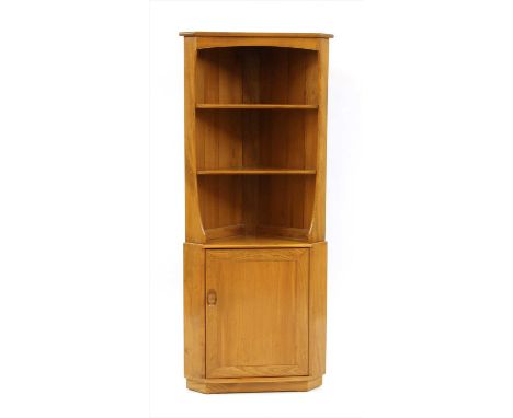 An Ercol elm standing corner cupboard, with open upper section, 179cm high