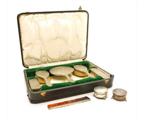 A cased silver backed brush set , Birmingham 1921, makers Walker and Hall, together with two lidded boxes