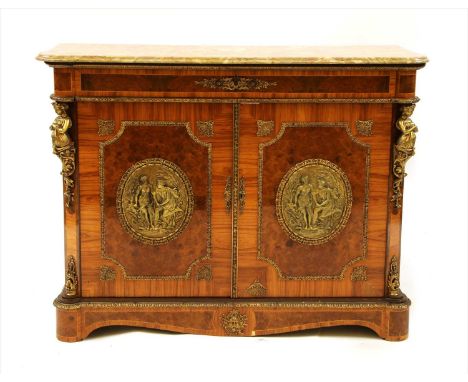 A French Louis XV style kingwood and brass walnut veneered credenza, the marble top above a pair of doors, each centred with 