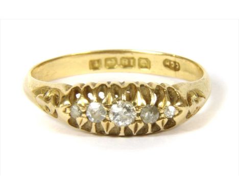 An 18ct gold diamond boat shaped ring, with a row of graduated old European and eight cut diamonds, claw set to engraved palm