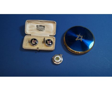 A cased pair of .925 silver and enamel Masonic cufflinks; together with a similar Masonic locket; and a metal powder compact.