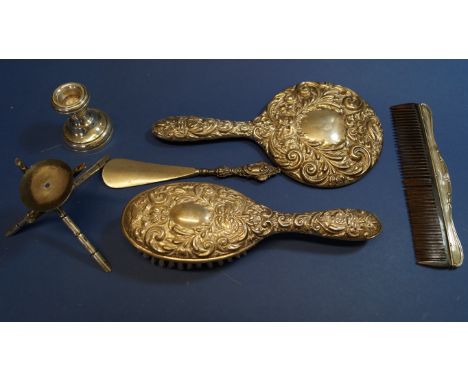 A silver hand mirror and matching brush, having green man and floral swag decoration; together with a silver mounted comb and