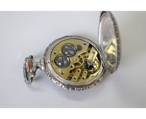 A late 19th/early 20th century continental .800 cased hunter pocket watch, the 3.6cm white enamel dial decorated Roman numera