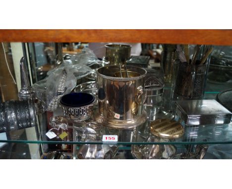 A shelf of silver plate and sundry.