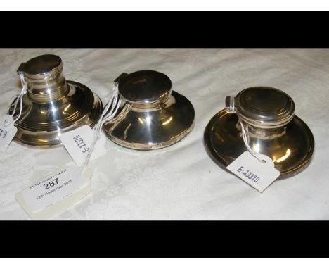 A silver capstan inkwell with Chester hallmark, together with two others 