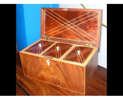 An early 19th century mahogany tea caddy with three divisions - width 26cm 