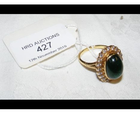 An emerald and diamond ring in 18ct gold setting CONDITION REPORT9.6gsize R/Sstone has flaws