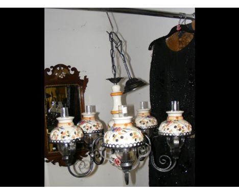 A five branch wrought iron and ceramic ceiling light 