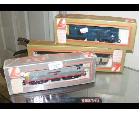 A boxed Lima diesel locomotive, together with two others 