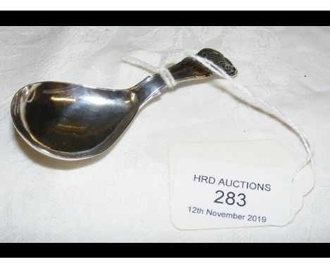 A silver caddy spoon 