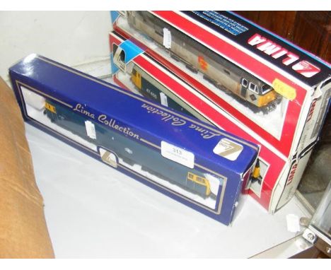 A boxed Lima diesel locomotive, together with two others 