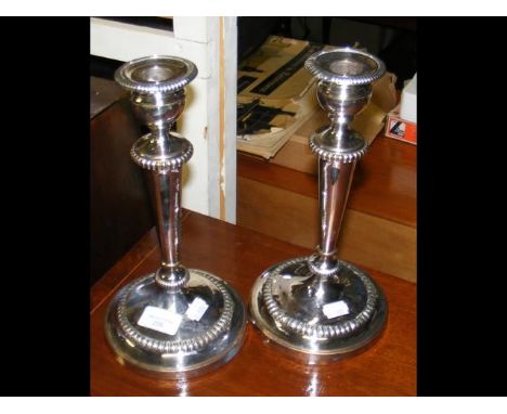 A pair of silver plated candlesticks 