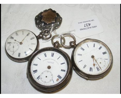 A silver cased pocket watch, together with others 