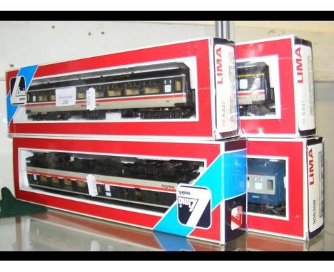 Four boxed Lima carriages 