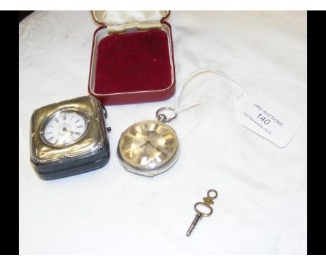 A silver cased pocket watch with engine turned decoration, together with a silver cased pocket watch in travelling case 