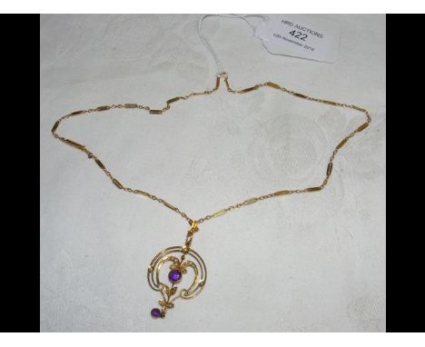 An Edwardian amethyst and seed pearl pendant on chain in 9ct gold mount  