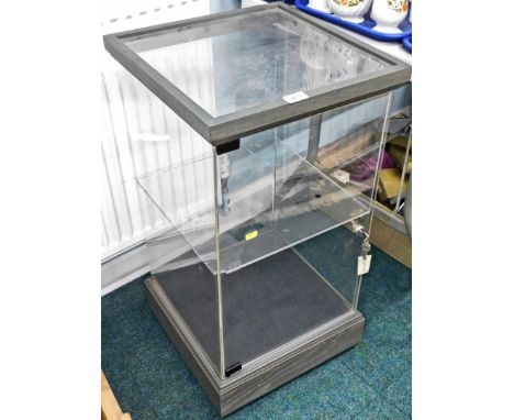 A Perspex table top display cabinet, with single shelf, lock and key, 76cm high, 40cm wide.