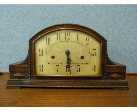An Art Deco oak mantel clock 